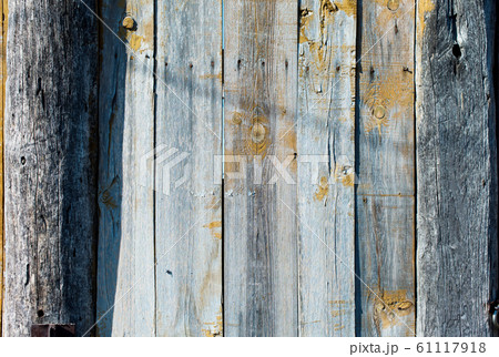 Old shabby wooden planks with cracked color paint 61117918