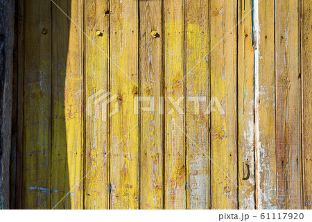 Old shabby wooden planks with cracked color paint 61117920