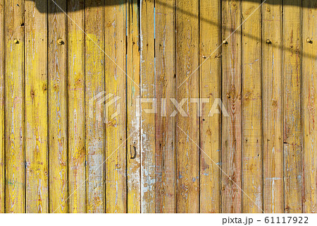 Old shabby wooden planks with cracked color paint 61117922