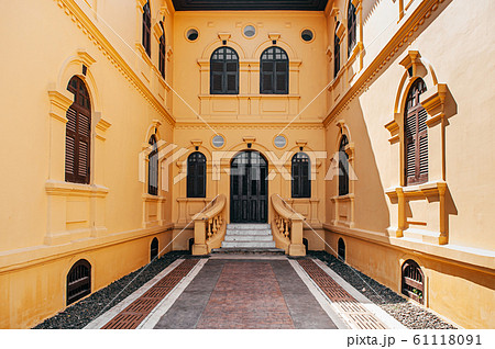 Yellow French Colonial building classic entrance courtyard of Udon Thani city museum. Thailand 61118091