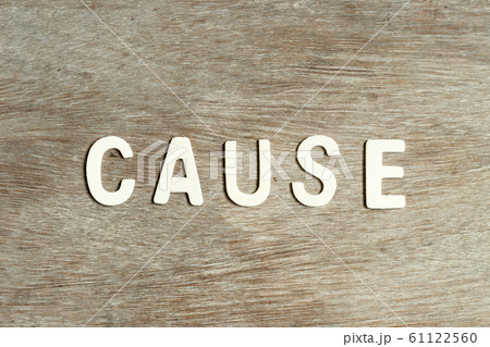Alphabet letter in word cause on wood background Alphabet letter in word cause on wood background 61122560