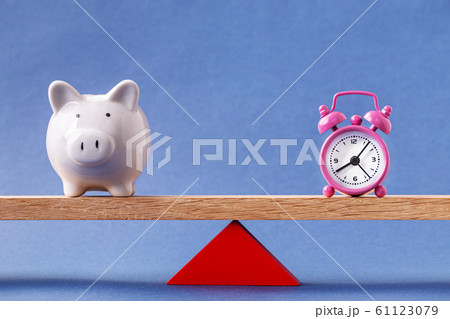 Balanced alarm clock and piggy bank Balanced alarm clock and piggy bank 61123079