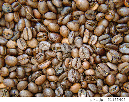 Brown roasted coffee beans Background. Brown roasted coffee beans Background. 61125405