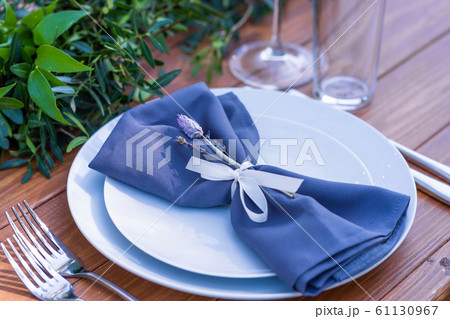 Beautifully decorated wooden table in a summer Beautifully decorated wooden table in a summer 61130967