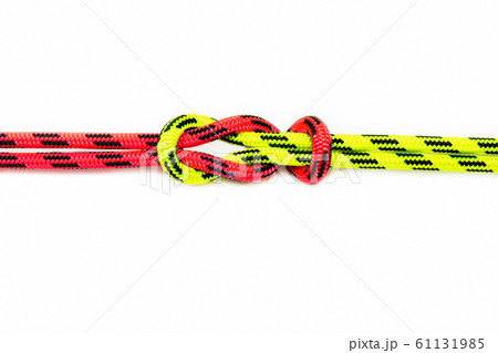 Reef, Hercules, square, double or brother hood Binding knot binding two colored (red and green) ropes. nautical loop used to secure rope or fishing line around an object. Isolated on white background 61131985