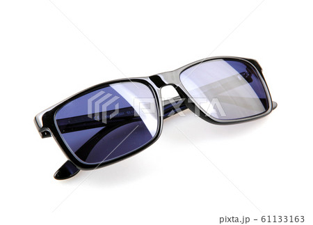Close-Up Of Sunglasses Against White Background Close-Up Of Sunglasses Against White Background 61133163