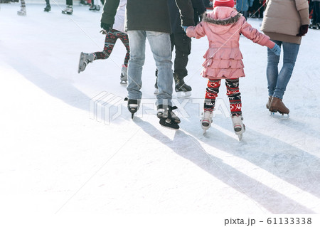 People ride on the skating rink People ride on the skating rink 61133338