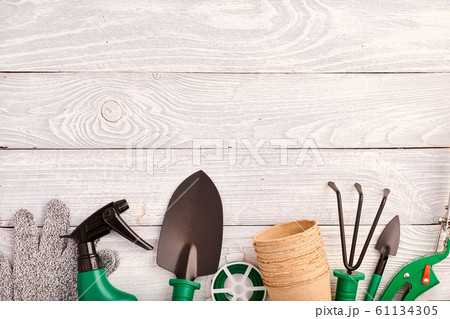 Gardening tools on wooden background flat lay Gardening tools on wooden background flat lay 61134305
