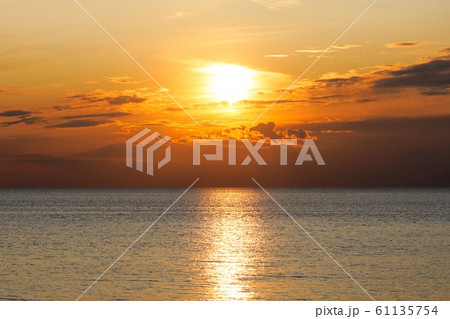 Dramatic sky at sunset near the sea Dramatic sky at sunset near the sea 61135754