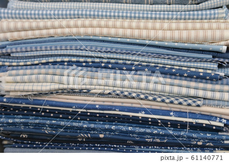stack of pieces fabric many pattern on shelf, material recycle for clothing fashion design stack of pieces fabric many pattern on shelf, material recycle for clothing fashion design 61140771