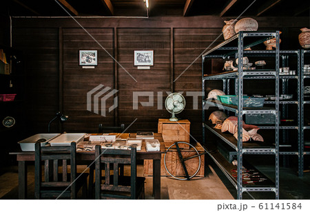 Ancient pottery at Archeologist workshop in Ban Chiang Museum 61141584