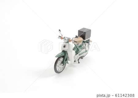 a scale of figure man riding red motor bike. 61142308