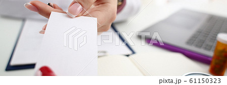 Female physician hand give white blank 61150323