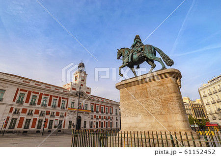 Madrid Spain, city skyline at Puerta del Sol and Clock Tower of Sun Gate with Equestrian Statue of Carlos III Madrid Spain, city skyline at Puerta del Sol and Clock Tower of Sun Gate with Equestrian Statue of Carlos III 61152452