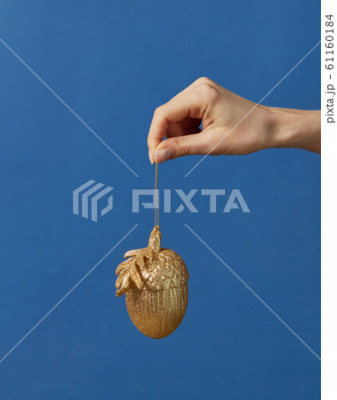New Year decoration hanging on a hand. 61160184