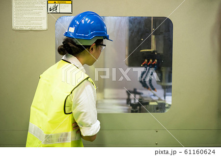 Factory worker check automate robot machine 61160624