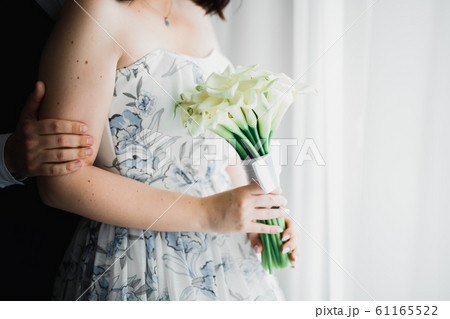 Romantic wedding moment, couple of newlyweds smiling portrait, bride and groom hugging Romantic wedding moment, couple of newlyweds smiling portrait, bride and groom hugging 61165522