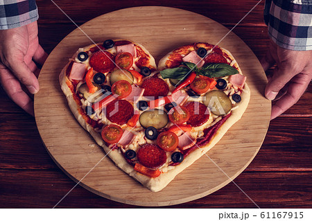 Heart shaped pizza 61167915