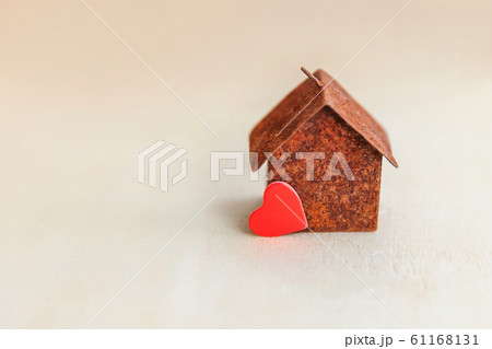 Miniature toy model house with red heart on wooden backdrop. Eco Village abstract environmental background. Real estate mortgage property insurance sweet dream home ecology concept Miniature toy model house with red heart on wooden backdrop. Eco Village abstract environmental background. Real estate mortgage property insurance sweet dream home ecology concept 61168131