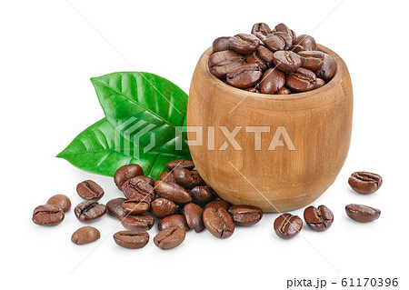 Heap of roasted coffee beans in wooden bowl with leaves isolated on white background. Heap of roasted coffee beans in wooden bowl with leaves isolated on white background. 61170396