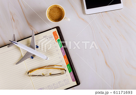 Travel office desk with notebook, glasses cup of 61171693