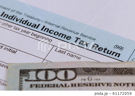American tax form and and US 100 dollar bills 61172059