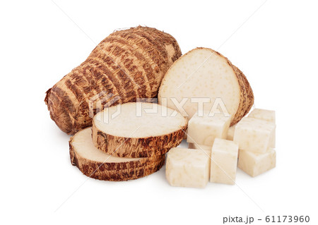 fresh taro root with slices isolated on white background fresh taro root with slices isolated on white background 61173960