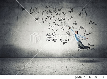 Businessman fly on balloons 61180364