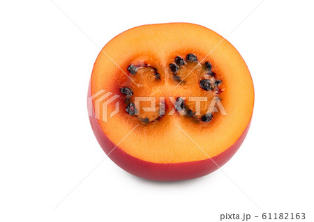 Fresh tamarillo fruit half isolated on white background Fresh tamarillo fruit half isolated on white background 61182163