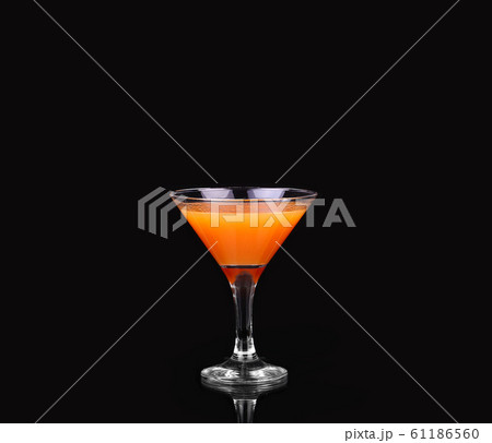 Carrots and juice in a glass Carrots and juice in a glass 61186560