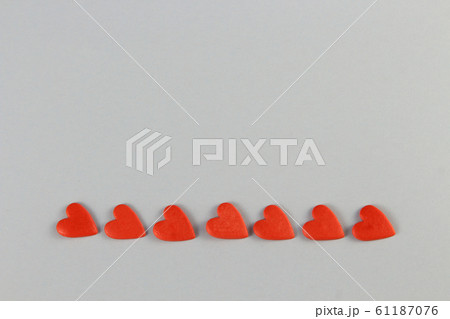 red hearts on a blue background laid out in a row red hearts on a blue background laid out in a row 61187076