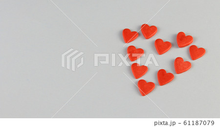 heart consists of little red hearts on a blue 61187079
