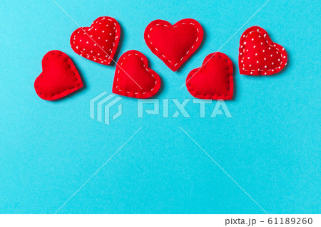 Composition of textile red hearts on colorful Composition of textile red hearts on colorful 61189260