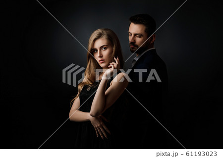 elegant couple on black background. 61193023