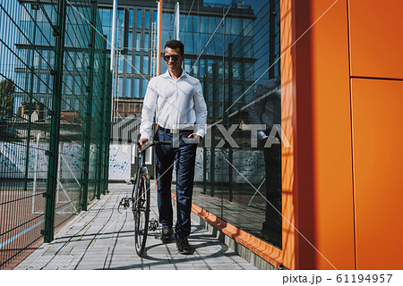 Merry man walking with bike stock photo Merry man walking with bike stock photo 61194957