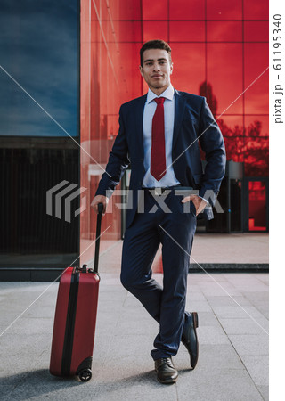 Joyful young man with suitcase stock photo Joyful young man with suitcase stock photo 61195340