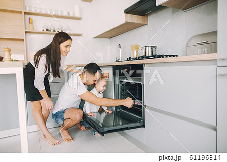 Family with little son having fun at home 61196314