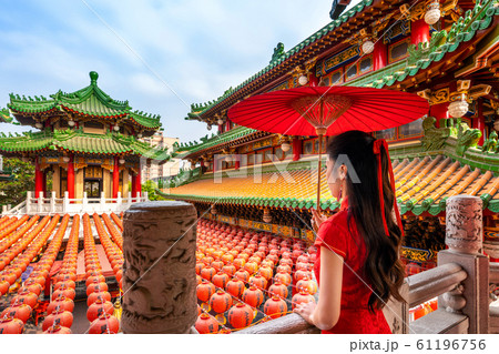 Asian woman wearing traditional Chinese dress at Sanfeng Temple in Kaohsiung, Taiwan. 61196756