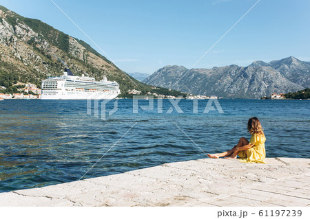 Girl looks at the ship 61197239