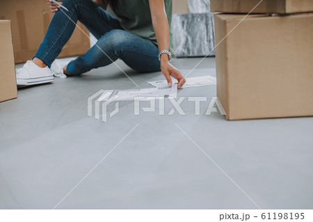 Close up of woman is holding layout of the apartment 61198195