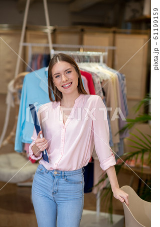 Young and successful female designer presenting her work. 61199159