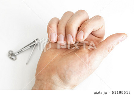 Trimmed nails of a young man. Closeup. Trimmed nails of a young man. Closeup. 61199615
