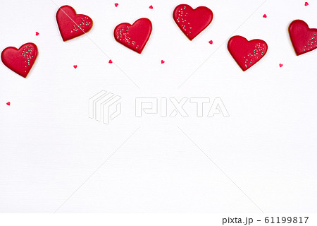 Gingerbread cookies with frosting in the shape of a heart. 61199817