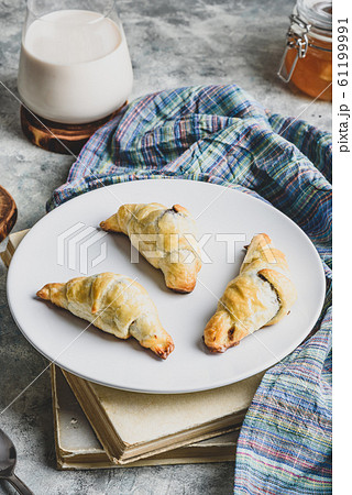 Chocolate croissants with milk for breakfast 61199991