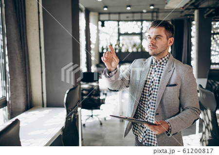 Young Office Employee is Pointing Out Important Issues Young Office Employee is Pointing Out Important Issues 61200817