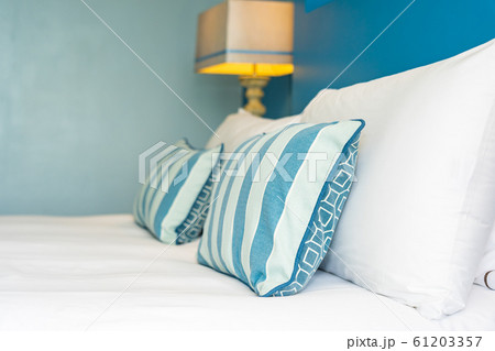 White comfortable pillow on bed decoration interior 61203357
