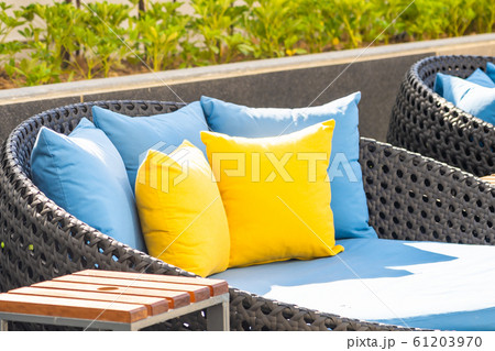 Outdoor patio in the garden with sofa chair and pillow decoration 61203970