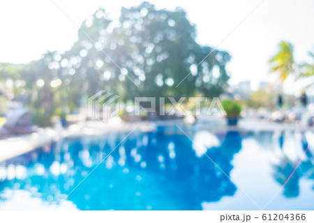 Abstract blur outdoor swimming pool in hotel resort 61204366