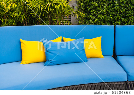 Outdoor patio in the garden with sofa chair and pillow decoration 61204368