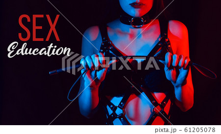 girl in a leather belt with a leather whip for BDSM sex 61205078